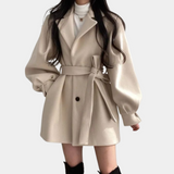 Chic women's coat with trendy puff sleeves and stylish belt